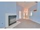 Living room with fireplace, carpet, and light blue walls at 6617 Old Newbury Ave, Las Vegas, NV 89108