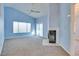 Living room with vaulted ceilings, fireplace and sliding door to patio at 6617 Old Newbury Ave, Las Vegas, NV 89108