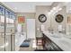 Bathroom with a bathtub, shower, double vanity, dark wood cabinets, and neutral wall color at 6914 Willowcroft St, Las Vegas, NV 89149