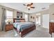 Bright main bedroom featuring a king-size bed and ensuite bathroom access at 6914 Willowcroft St, Las Vegas, NV 89149