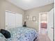 Comfortable bedroom with full-size bed and access to hallway at 6914 Willowcroft St, Las Vegas, NV 89149