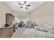 Home office featuring a desk with built-in storage, a chair, a sofa, and a ceiling fan at 6914 Willowcroft St, Las Vegas, NV 89149