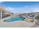 Beautiful in-ground pool with rock waterfall, tanning shelf and manicured landscaping creates a private backyard retreat at 6914 Willowcroft St, Las Vegas, NV 89149