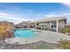 Large pool with a waterfall and spacious patio at 6914 Willowcroft St, Las Vegas, NV 89149