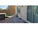 Backyard patio featuring a hot tub with a brick surround and sliding glass door at 7050 Fossil Rim St, Las Vegas, NV 89084