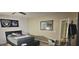 Cozy bedroom with a bed, mirror, and sports decor at 7050 Fossil Rim St, Las Vegas, NV 89084