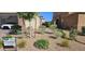 Landscaped front yard with gravel and plants at 7050 Fossil Rim St, Las Vegas, NV 89084