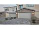 Two-car garage with paver driveway at 7050 Fossil Rim St, Las Vegas, NV 89084