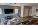 Comfortable living room with wood-look flooring and plenty of natural light at 7050 Fossil Rim St, Las Vegas, NV 89084