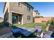 Backyard with patio furniture and grass at 7122 Rocket Launch St, North Las Vegas, NV 89084