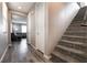 Hallway with stairs leading upstairs and view into living room at 7122 Rocket Launch St, North Las Vegas, NV 89084