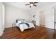 Bedroom with hardwood floors and white metal bed frame at 7307 Iron Oak Ave, Las Vegas, NV 89113