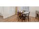 Bright dining area with wood table and four chairs at 7307 Iron Oak Ave, Las Vegas, NV 89113