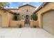 Front entrance with stone facade and wrought iron gate at 7307 Iron Oak Ave, Las Vegas, NV 89113