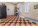 Garage with checkerboard floor and storage shelving at 7307 Iron Oak Ave, Las Vegas, NV 89113