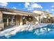 Relaxing pool and spa area with patio furniture and a covered patio at 7307 Iron Oak Ave, Las Vegas, NV 89113