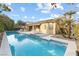 Inviting pool and spa with expansive patio and seating at 7307 Iron Oak Ave, Las Vegas, NV 89113