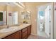 Well-lit bathroom with double sinks and a separate toilet area at 8157 Amy Springs St, Las Vegas, NV 89113