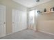 Bright bedroom with double door closet and carpeted floor at 8157 Amy Springs St, Las Vegas, NV 89113