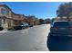 Residential street with parked cars and two-story houses at 8157 Amy Springs St, Las Vegas, NV 89113