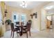 Dining area with a round table and four chairs, adjacent to kitchen at 8157 Amy Springs St, Las Vegas, NV 89113