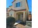 Two-story house with green door and landscaping at 8157 Amy Springs St, Las Vegas, NV 89113