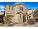 Two-story house with light beige exterior, landscaping, and a driveway at 8157 Amy Springs St, Las Vegas, NV 89113