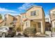 Two-story house with light beige exterior, landscaping, and a driveway at 8157 Amy Springs St, Las Vegas, NV 89113