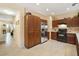 Kitchen with wooden cabinets, stainless steel appliances, and tile floor at 8157 Amy Springs St, Las Vegas, NV 89113