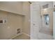 Laundry room with built-in shelving and access to hallway at 8157 Amy Springs St, Las Vegas, NV 89113