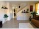 Living room with tiled floors, a beige couch, and a staircase at 8157 Amy Springs St, Las Vegas, NV 89113