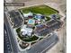 Aerial view showcases Skye Canyon Park with Skye Fitness, Skye Bistro, sports field, splash pad, and home finding center at 8224 Skye Territory St, Las Vegas, NV 89166