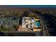 Aerial view of a two-story house with solar panels, pool, and landscaped yard at 8224 Skye Territory St, Las Vegas, NV 89166