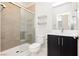 Clean bathroom with a walk-in shower, modern vanity, and tile flooring at 8224 Skye Territory St, Las Vegas, NV 89166