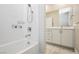 Bathroom with shower/tub combo, vanity, and white tile at 8224 Skye Territory St, Las Vegas, NV 89166