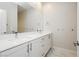 Double vanity bathroom with modern white cabinets at 8224 Skye Territory St, Las Vegas, NV 89166