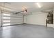 Spacious and clean garage features a modern door with window inserts, freshly painted walls, and epoxy floors at 8224 Skye Territory St, Las Vegas, NV 89166