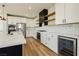 Modern kitchen with white cabinets, quartz countertops, and stainless steel appliances at 8224 Skye Territory St, Las Vegas, NV 89166