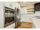 Modern kitchen with stainless steel appliances and white cabinets at 8224 Skye Territory St, Las Vegas, NV 89166