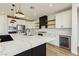 Modern kitchen featuring white cabinets, a large island, and quartz countertops at 8224 Skye Territory St, Las Vegas, NV 89166