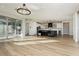 Bright living room with hardwood floors, large windows, and a chandelier at 8224 Skye Territory St, Las Vegas, NV 89166