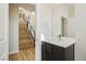 Modern powder room with dark vanity and a mirror at 8224 Skye Territory St, Las Vegas, NV 89166