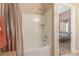 Bathroom with shower/tub combo, and a view into a bedroom at 8985 S Durango Dr # 2047, Las Vegas, NV 89113