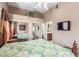 Bedroom with mirrored closet doors and a ceiling fan at 8985 S Durango Dr # 2047, Las Vegas, NV 89113