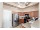 Modern kitchen featuring stainless steel appliances and wood cabinets at 8985 S Durango Dr # 2047, Las Vegas, NV 89113