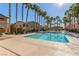 Community pool with surrounding lounge chairs at 8985 S Durango Dr # 2047, Las Vegas, NV 89113