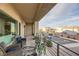 Relaxing balcony with seating area and view of the neighborhood at 9045 Knots Estate St, Las Vegas, NV 89139