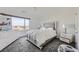 Bright bedroom with a large window and modern dresser at 9045 Knots Estate St, Las Vegas, NV 89139