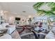 Bright and airy living room with comfortable white sofas and large windows at 9045 Knots Estate St, Las Vegas, NV 89139