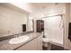 Modern bathroom with granite vanity and walk-in shower at 9131 Hitmaker St, Las Vegas, NV 89113